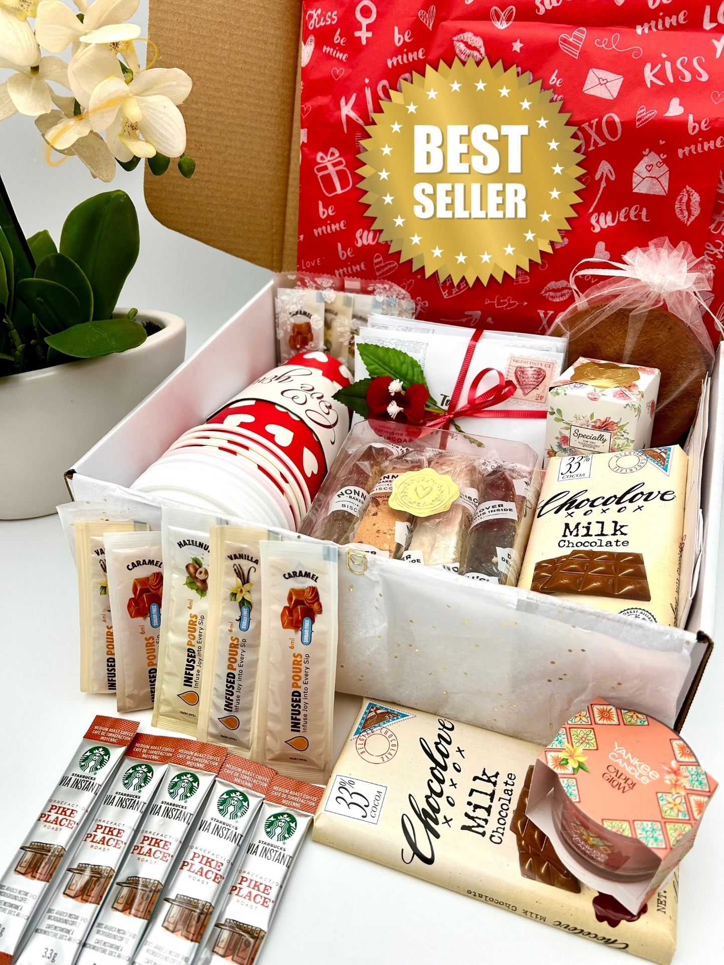 Valentine's Gourmet gift box with Starbucks coffee, cups, biscotti, Chocolove Belgian Chocolate Bar, flavored syrups, nonnis biscotti, Yankee Candle